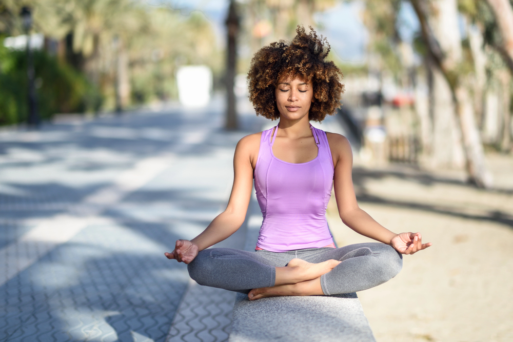 A learner practicing yoga and mindfulness